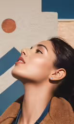 a woman with earphones in a coat looking up at the sky