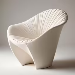 the chair has a curved shaped up shell in white