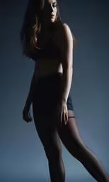 a girl in tight clothing with her leg in a tight body