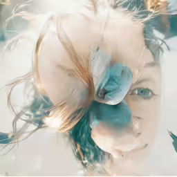 a very blurry shot of a beautiful girl holding a flower