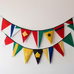 a wall hanging with several triangular flags and one has a star on it