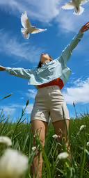 a woman is throwing the birds into the air