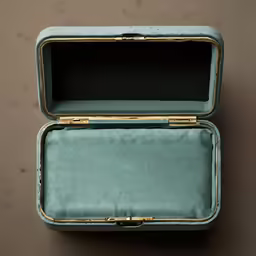 an open small blue suitcase on a brown table