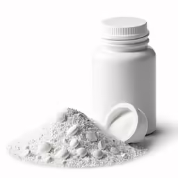 powdered white pills spilling out of a bottle