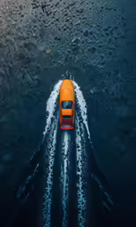 an aerial view of a vehicle on the water