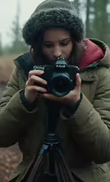 the photographer is taking a picture in the woods