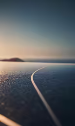 a line going through a body of water with a boat in the distance