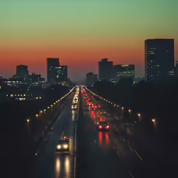 several cars on a highway at dusk