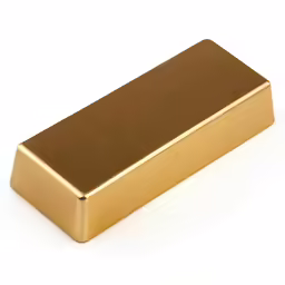 a golden metal object is on a white surface