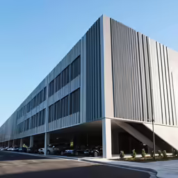 an architectural structure of a building that has lots of windows