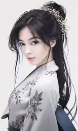 an asian woman in an oriental dress is posing for the camera