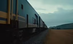 train stopped in the middle of a brown field