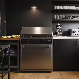 a kitchen that is black and white in color