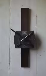 a black clock with white numbers on the face
