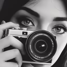 a woman taking a picture with a camera