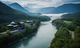 a river flowing between two mountains with homes