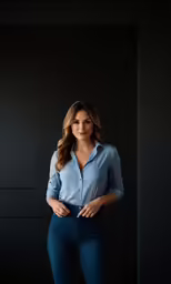 a beautiful woman posing with her hands in her pockets