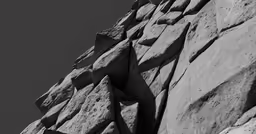 some rocks and a sky in a black and white photo