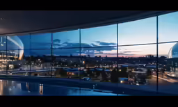 an illuminated building is viewed through a window