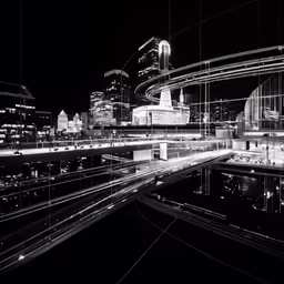 a black and white photograph of a city at night