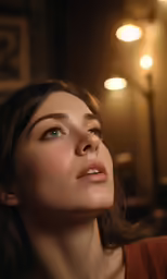 the woman is staring at the lights in her room