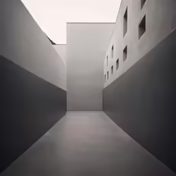 a long narrow hallway that runs between two buildings