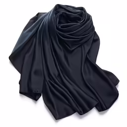 the long silk scarf in black is draped