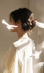 the woman is looking back at the shadow