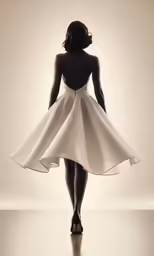 a woman in a white dress standing with her back to the camera