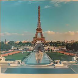 a person standing in front of the eiffel tower