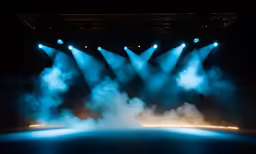 blue light at stage with smoke coming from it