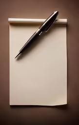 a pen sitting on top of a piece of paper