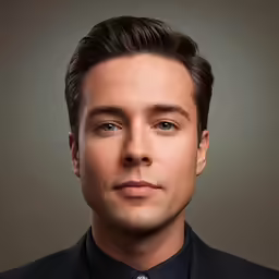 this photo is taken of an actor wearing a suit and tie