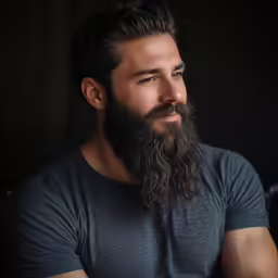 a man with a long beard and a goatee hairstyle