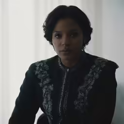 a woman looking to the side with an angry look on her face