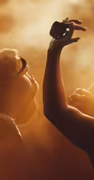 two people are in the air with an object
