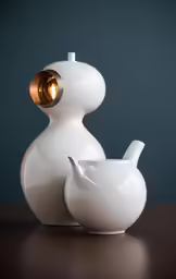 the modern lamp on top of the bottle has a glowing light on it
