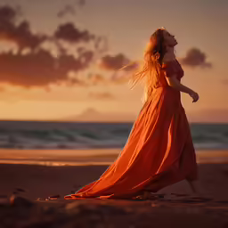 a woman in an orange dress walks on the beach