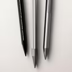 two pens sitting on top of each other