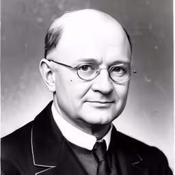 the portrait of an older man with a suit on