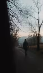 the man is riding his bike down the street