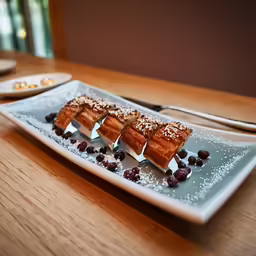 some kind of dessert with berries on the side
