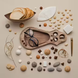 a wooden tray with several items sitting on top of it