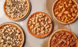 five pies are made to look like different types of nuts