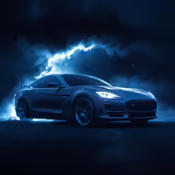 an all black car in the dark with the headlights lit