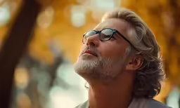 a man with a beard wearing sunglasses