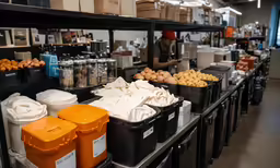 various bins and containers filled with food at a store