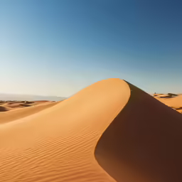 there is sand on the beach with a sky background