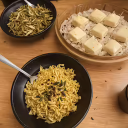 bowls and bowls of rice with tofu and other foods in them