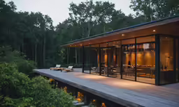 the view from inside the house in front of the deck and the outside patio